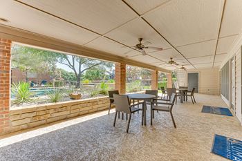 A patio with a table and chairs is shown.
